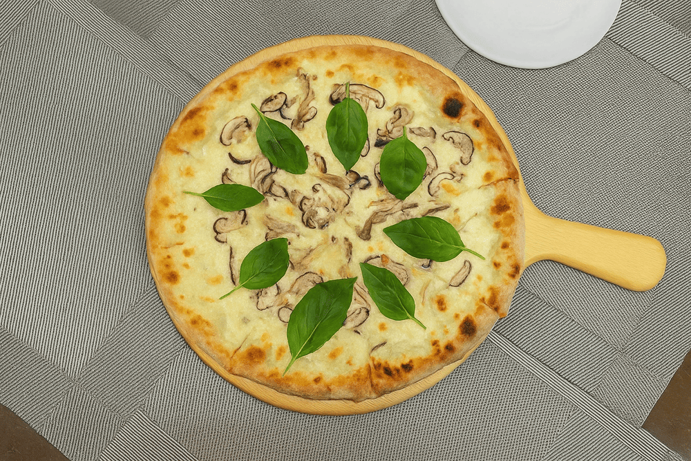 A beautifully crafted half-half pizza topped with a luscious ball of fresh burrata at the center is a bestseller at Palm Pizza